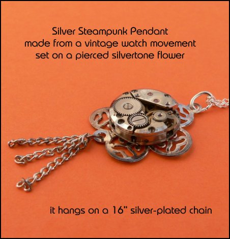 Silver steampunk pendnat made from a vintage watch movement set on a pierced silvertone flower
