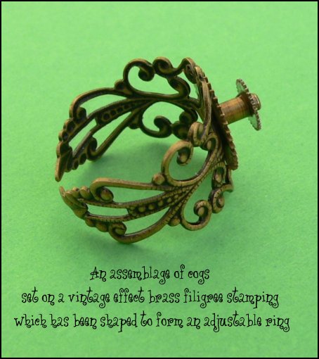 Steampunk ring made from recycled cogs and a vintage brass filigree stamping