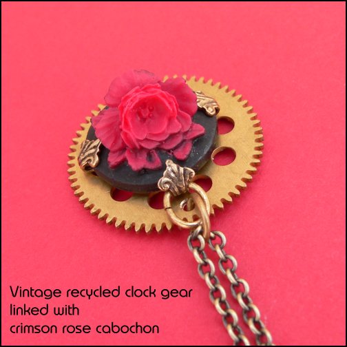 Gorgeous steampunk pendant constructed from a salvaged vintage clock part - a brass cog linked with a crimson red rose cabochon
