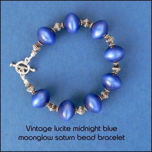 bracelet made from midnight blue vintage lucite saturn beads with tibetan silver fittings