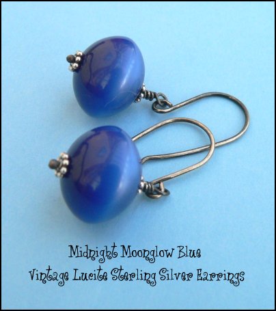 Beautiful gleaming dark blue vintage lucite moonglow beads gently swaying from handmade sterling silver earwires and accented with tiny Bali sterling silver daisies.