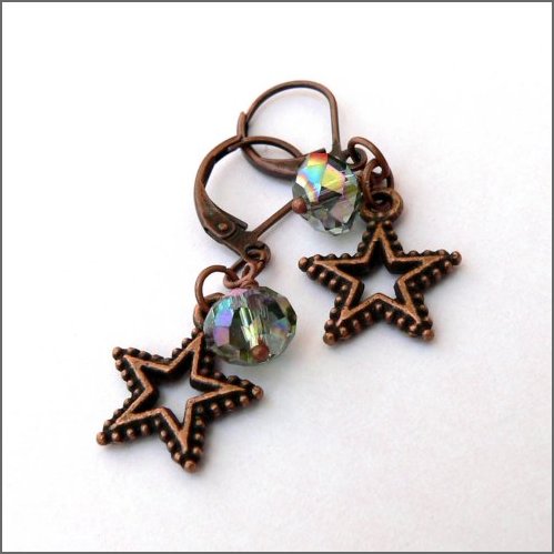 Copper effect stars ornamented with beautifully cut Czech glass rondelle beads which shine with a kind of indescribable pale pinky green colour!