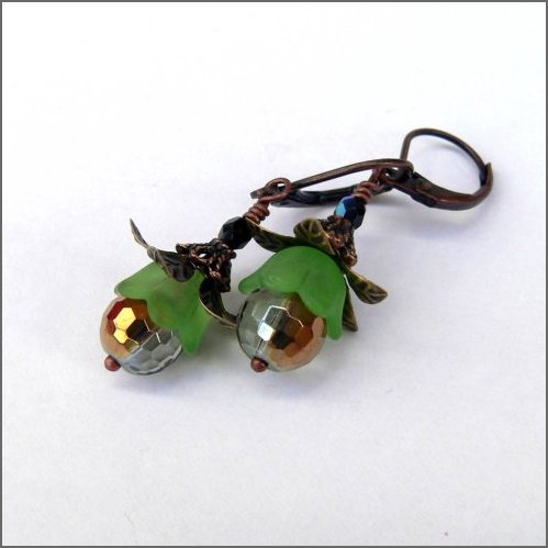Glittering golden faceted glass beads capped with green and adorned with bronze coloured petals and copper swaying under nickel free copper leverbacks 