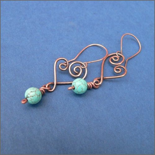 Hand-forged copper hearts each embellised with a pretty turquoise gemstone bead hanging from handmade copper earwires.